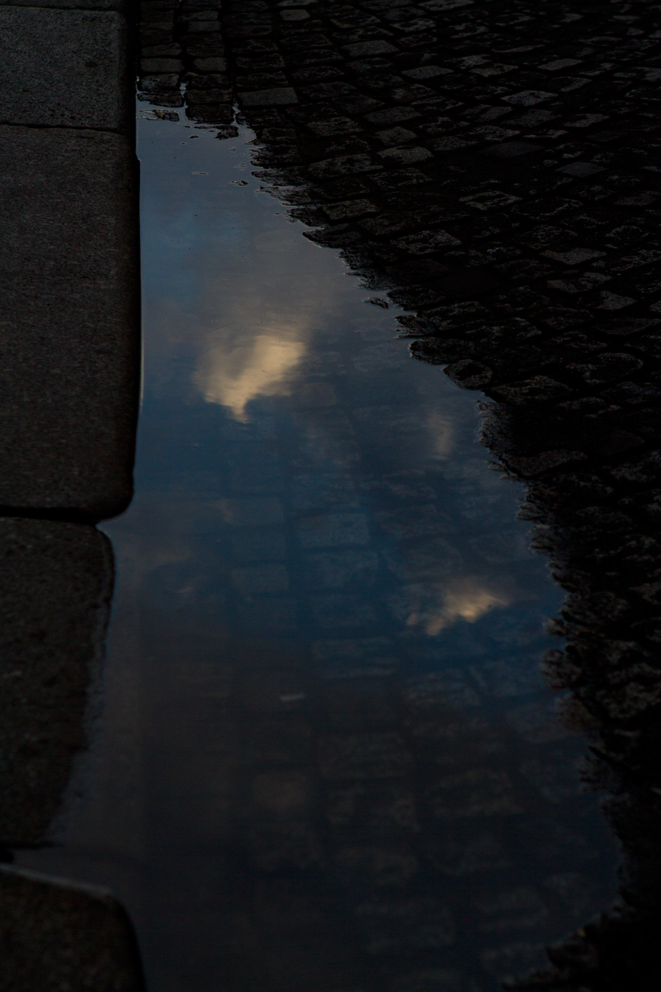 cloud-puddle-reflection-paris-cobbles-street